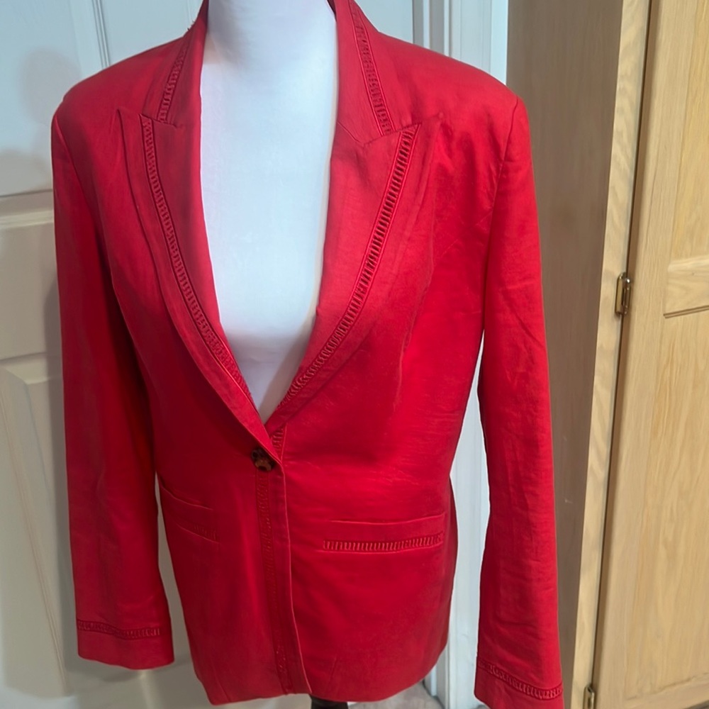 Red jacket with trim. Very good condition.